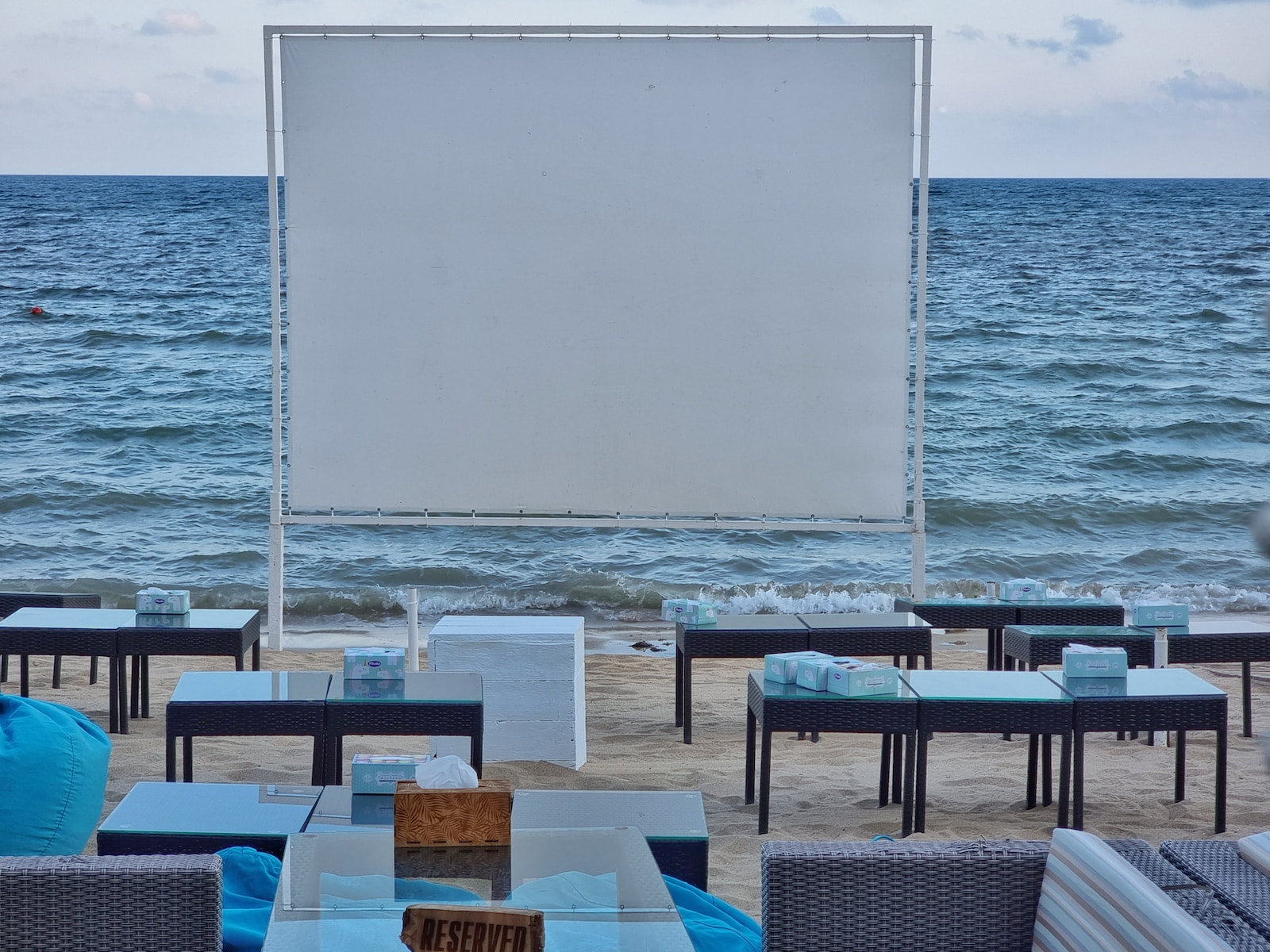 tables and chairs on a beach